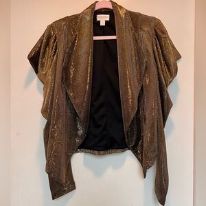 Women’s metallic gold blazer with puffed sleeves.